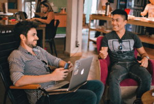 Young men talking happy