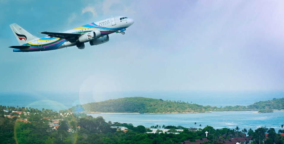 plane departing over beautiful island