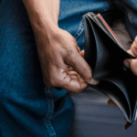 Man holding an empty wallet