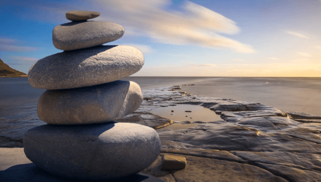 stacked rocks on a beach, meditation