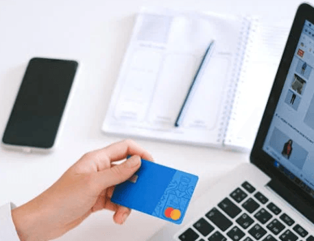 person entering credit card while doing online shopping
