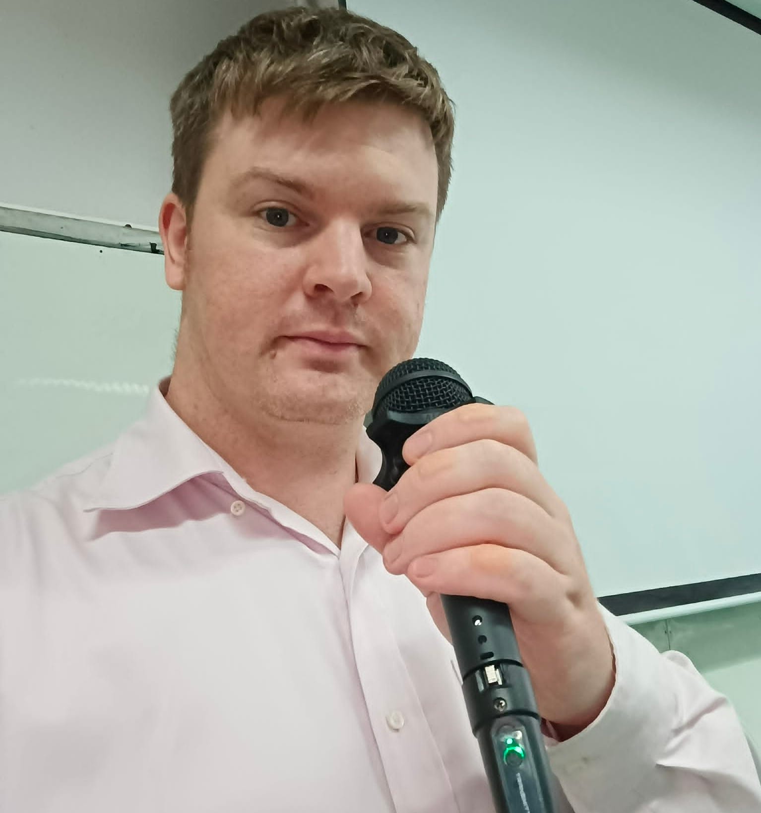 Picture of Teacher James Franklin with Microphone
